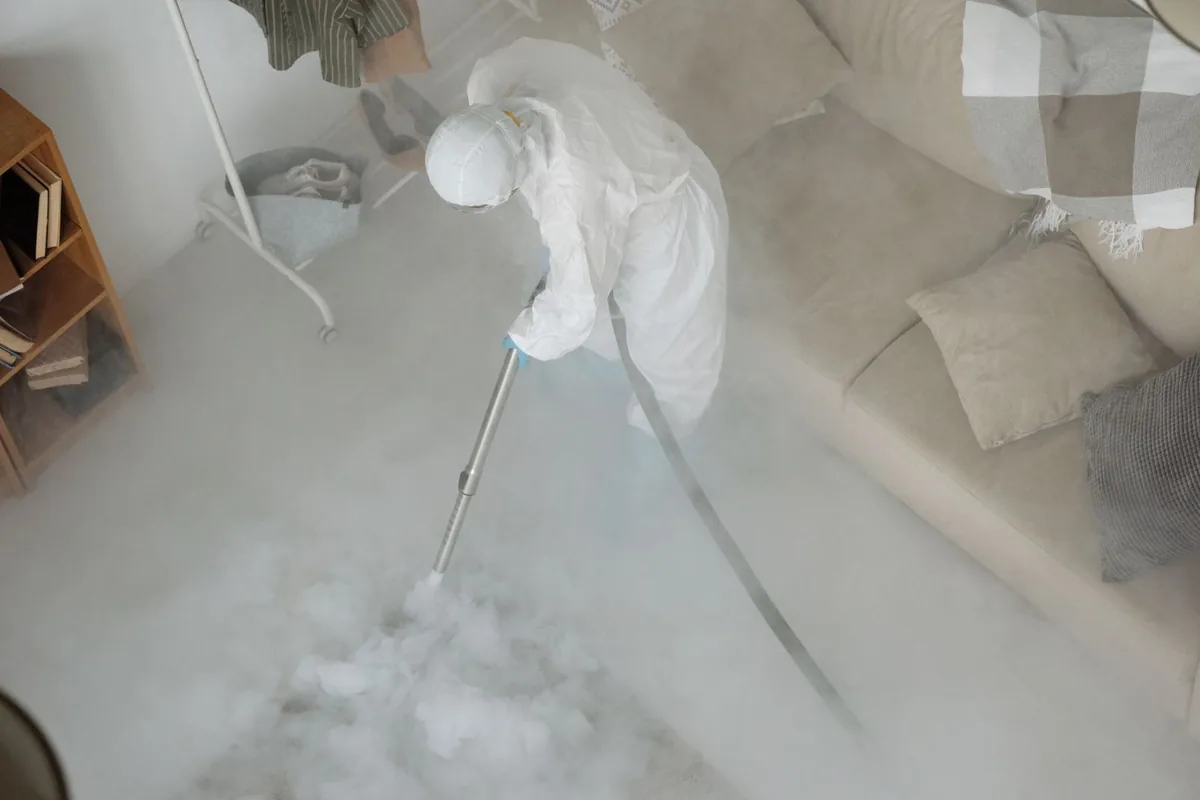 Biohazard cleanup technician in protective equipment, Berryville, AR